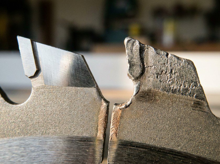 Close-up comparison of a sharp versus dull carbide saw blade tooth
